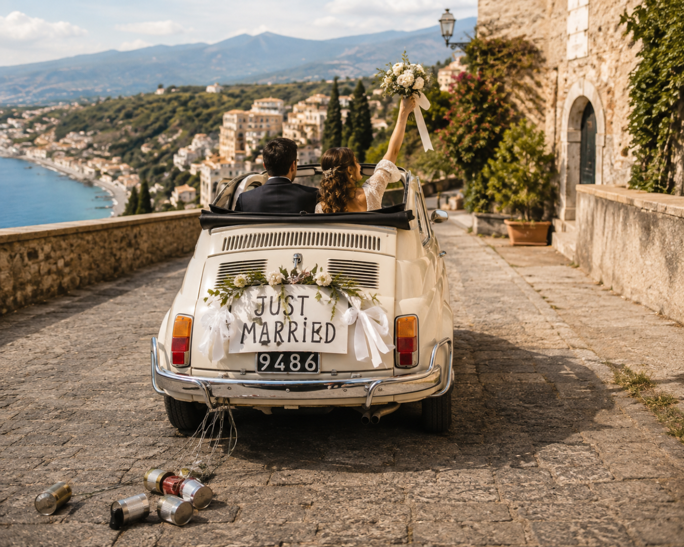 Newlywed couple riding away in a vintage car with a "Just Married" sign after their Sicily wedding